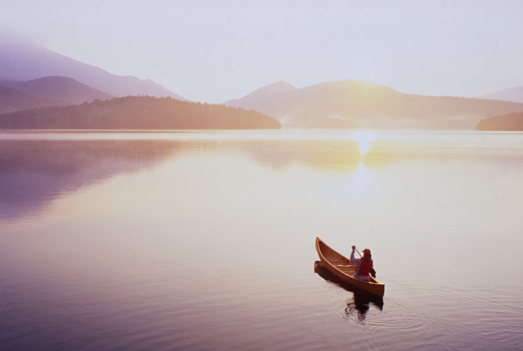 Woman canoeing on a sunny lake